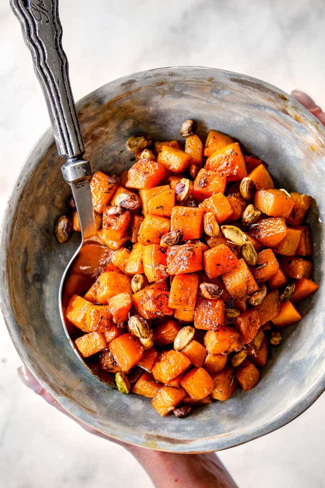 showing how to serve roasted butternut squash recipe in a serving bowl