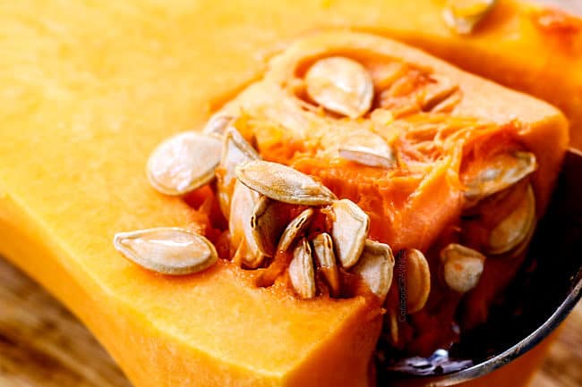 showing how to roast butternut squash by removing seeds
