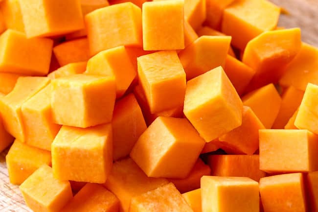 showing how to roast butternut squash by chopping into cubes