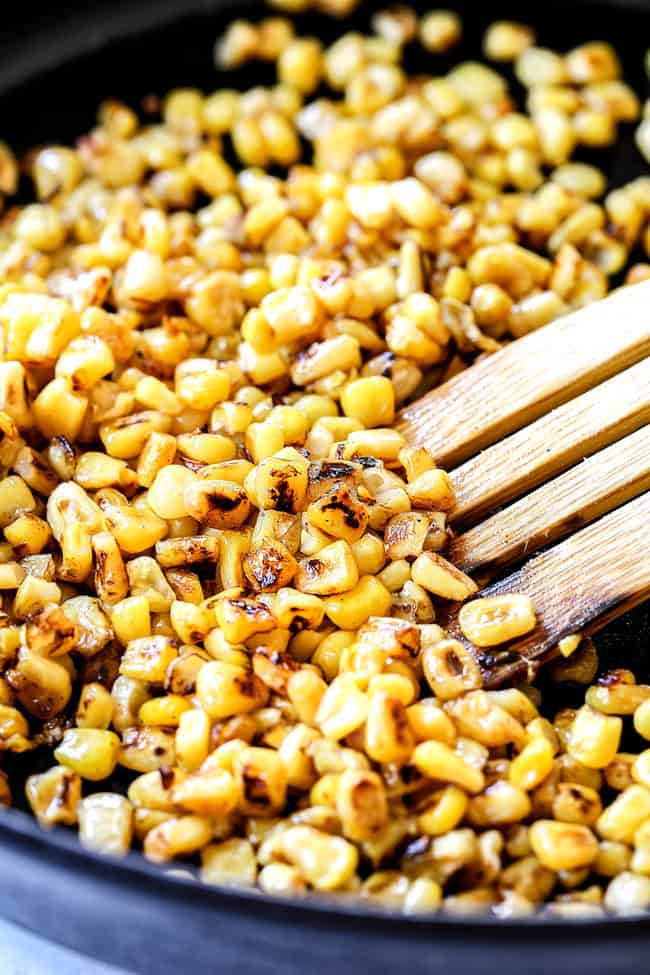 showing how to make black bean and corn salsa recipe by charring corn in a skillet