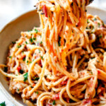 a fork picking up chicken spaghetti casserole