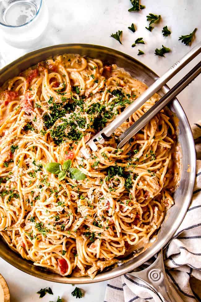 top view tongs serving chicken spaghetti recipe