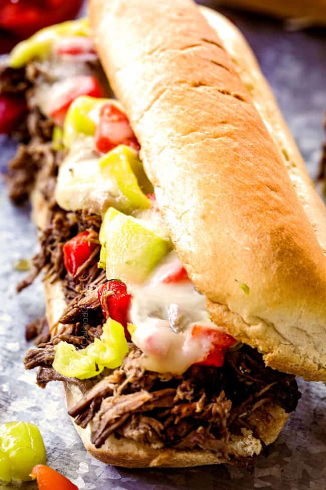 up close of crock pot Italian Beef Sandwich recipe laying on a tin
