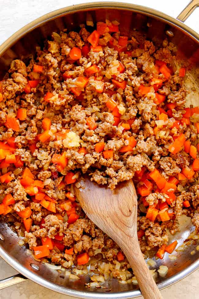 showing how to make rigatoni by cooking bell pepper with sausage