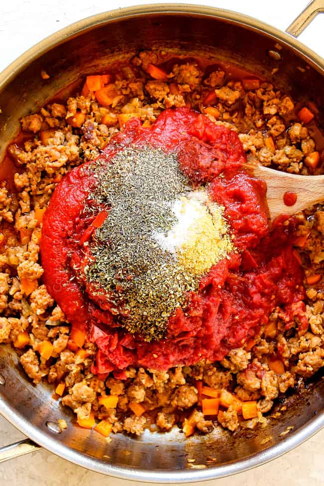 showing how to make rigatoni by adding crushed tomatoes, basil, parsley, oregano to sausage