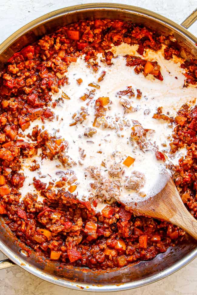 showing how to make rigatoni pasta by adding heavy cream
