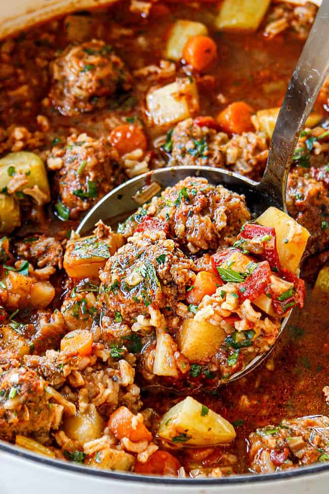 showing how to serve Albondigas Soup with an up close view of soup in a ladle