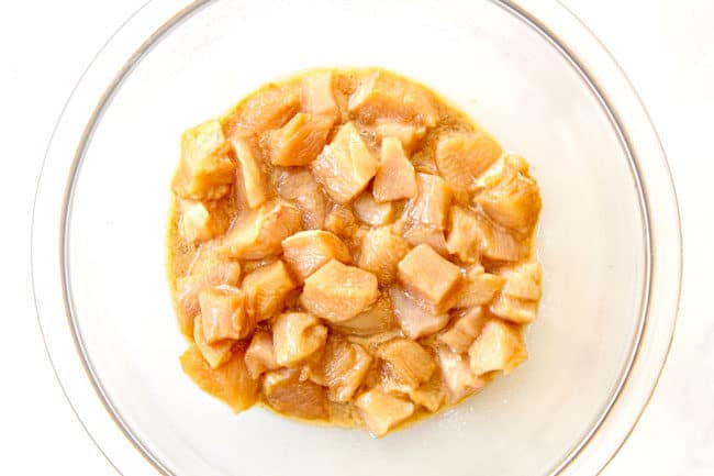 showing how to make chicken stir fry by velvetting chicken