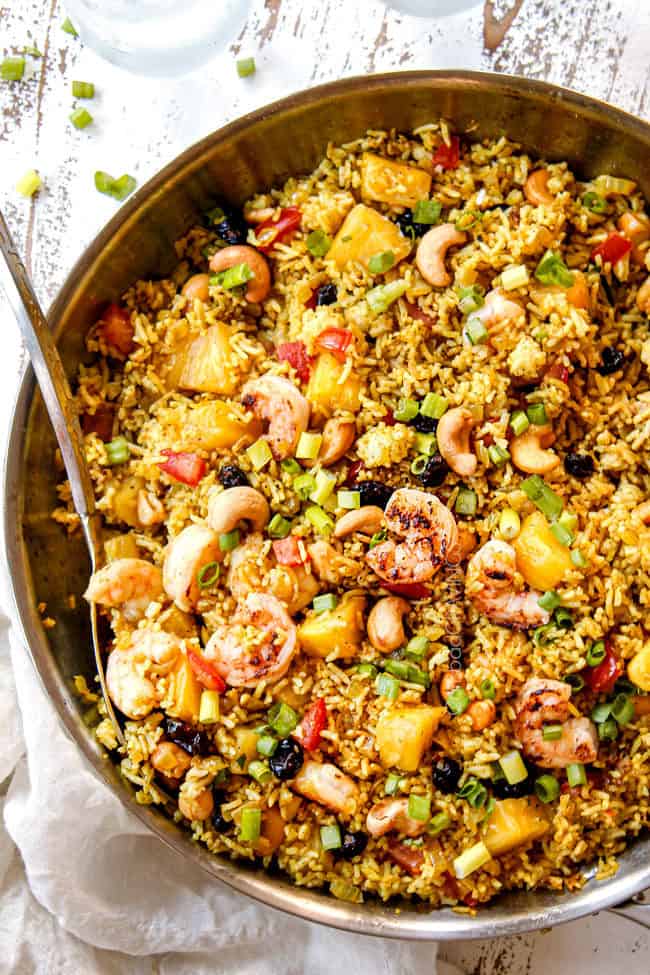 top view of making pineapple fried rice recipe with shrimp in a skillet