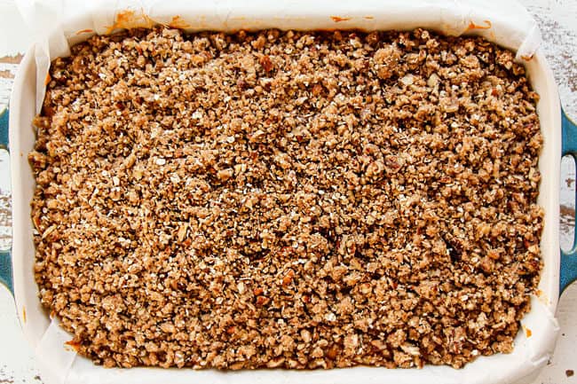 showing how to make best pumpkin cheesecake bars by baking until topping is set