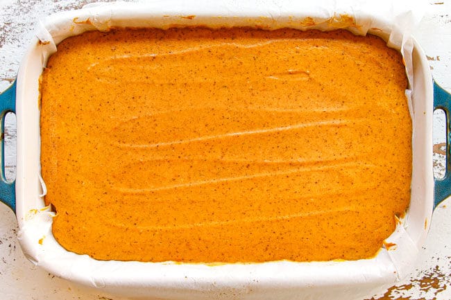 showing how to make pumpkin cheesecake bars by baking baking cheesecake before adding stresuel