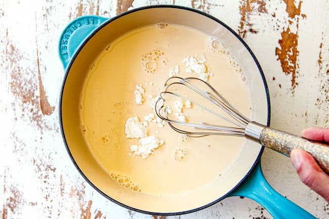 showing how to make queso blanco by whisking cornstarch into evaporated milk