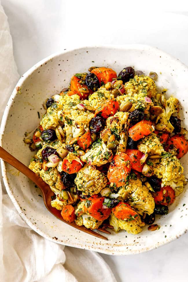 top view of easy Cauliflower Salad recipe on a white plate with a gold fork