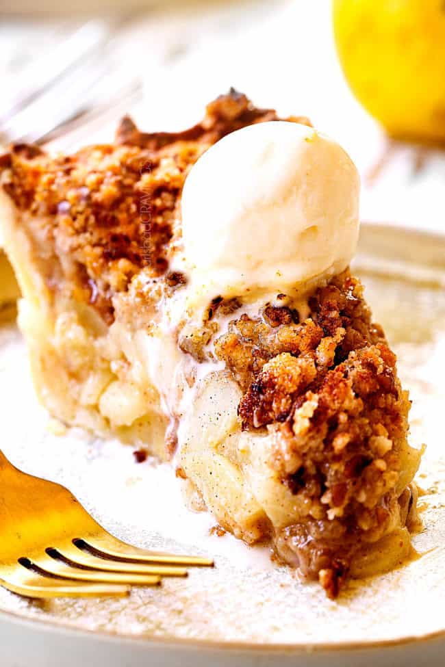 up close of a slice of simple pear pie with vanilla ice cream