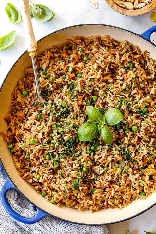 showing how to make rice pilaf with orzo by garnishing with fresh parsley