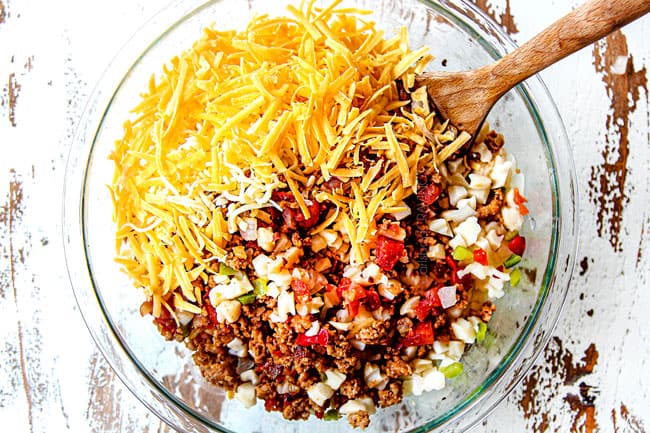 showing how to make easy breakfast casserole by adding sausage, hash browns and cheese to a bowl