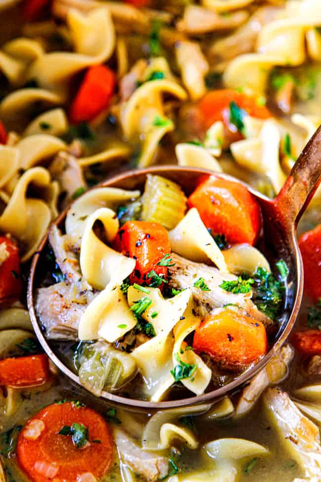 showing how to make homemade chicken noodle soup by stirring all the ingredients together
