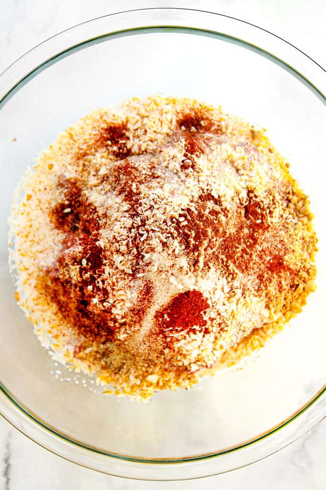 showing how to make cocktail meatballs by adding beef, eggs, milk and seasonings to a glass bowl