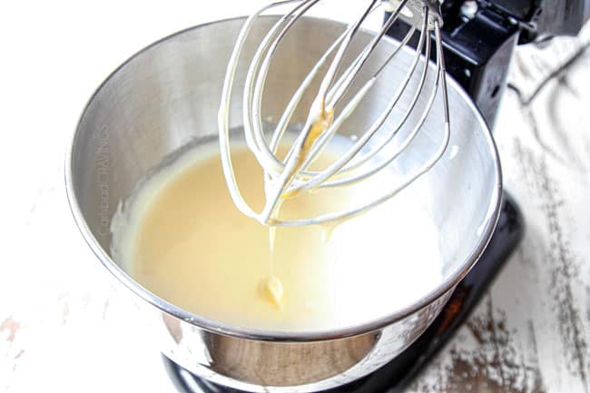 showing how to make tres leches cake recipe by beating eggs and sugar until thick and glossy