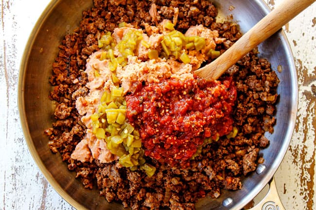 showing how to make ground beef taco recipe by adding refried beans, salsa and green chilie