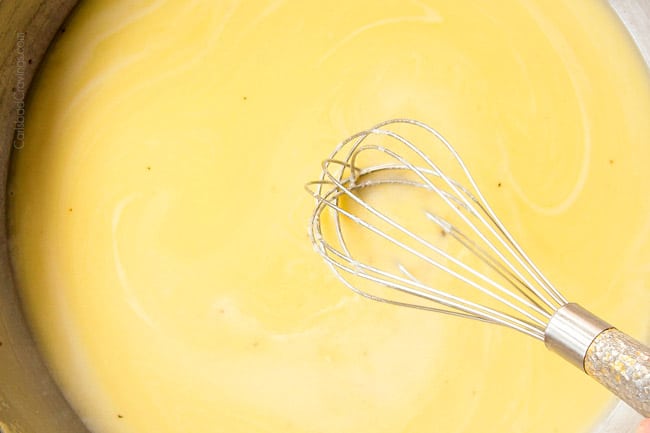 showing how to make Cacio e Pepe by whisking Pecorino Romano into butter and pasta water until smooth