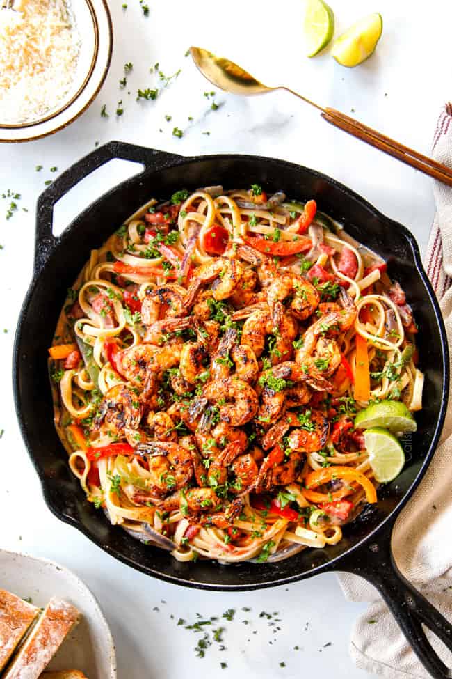 top view showing how to serve Cajun Shrimp Pasta by garnishing with lime juice