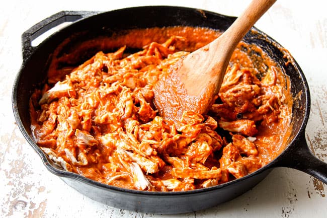 showing how to make Tostadas de Tinga by stirring chicken into chipotle sauce before adding to tostada shells