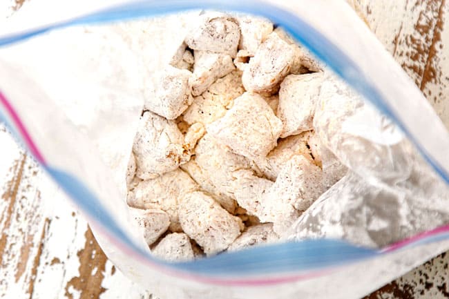 showing how to make orange chicken recipe by tossing chicken in flour breading