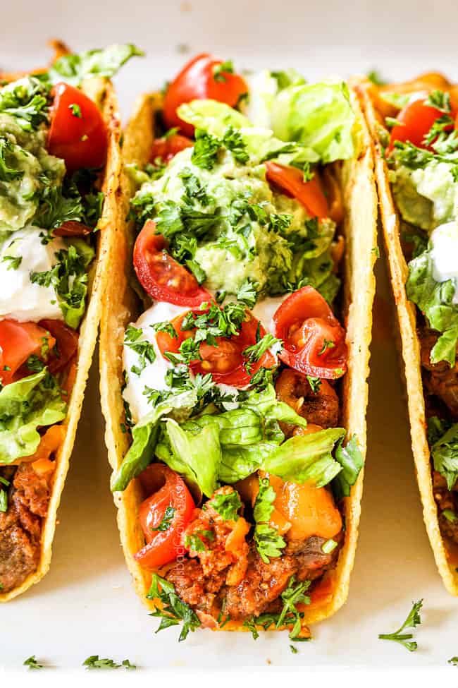 up close front view of ground beef taco with homemade taco seasoning and taco meat in a crispy baked shell