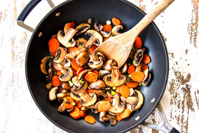 showing how to make Moo Goo Gai Pan by stir frying mushrooms and carrots