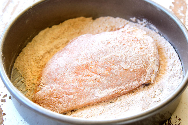 showing how to make chicken piccata recipe by dredging in flour