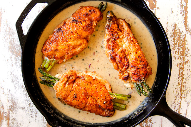 showing how to make chicken piccata recipe by adding chicken to lemon butter sauce