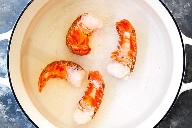 showing how to make lobster bisque by boiling lobster