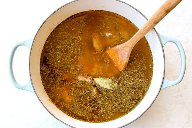 showing how to make chicken and wild rice soup by simmering wild rice, chicken broth, seasonings together