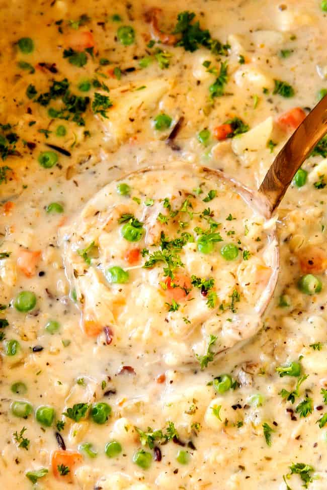 up close showing how to garnish chicken and rice soup with parsley