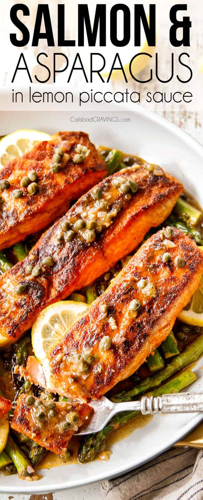 showing how tender lemon salmon and asparagus is taking a bite with a fork