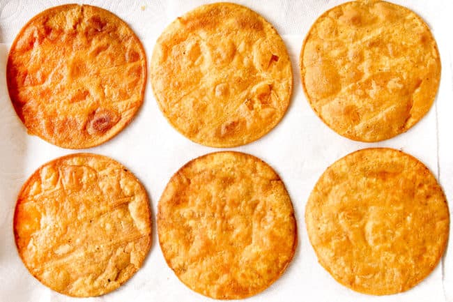 showing how to make tostada shells by placing on paper towels to drain after frying