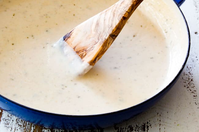 showing how to make Tuna Casserole recipe by simmering Mornay sauce until thickened