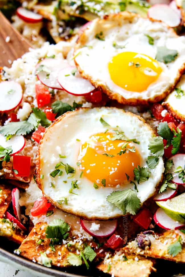 up close showing the consistency of Chilaquiles with Fried Eggs