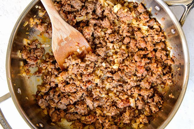 showing how to cook linguine by browning Italian sausage in a skillet