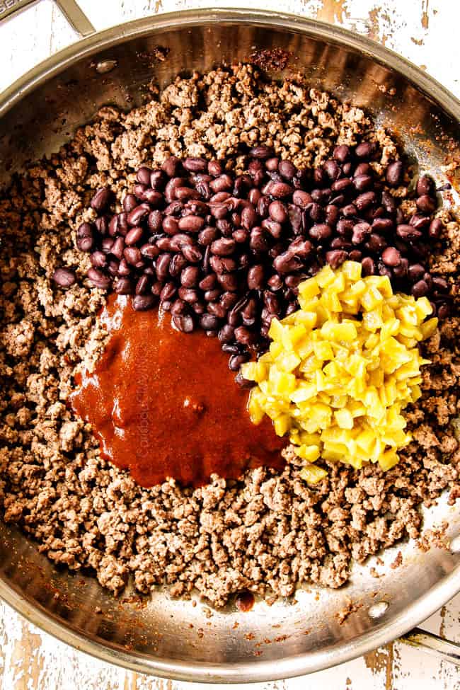 showing how to make beef enchilada recipe by browning beef and onions then adding enchilada sauce, black beans and green chilies