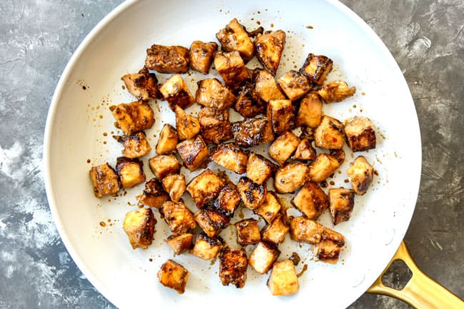 showing how to make Chicken and Broccoli recipe by stir frying chicken in a skillet