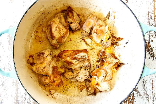 showing how to make chicken and dumplings recipe by searing chicken in a Dutch oven