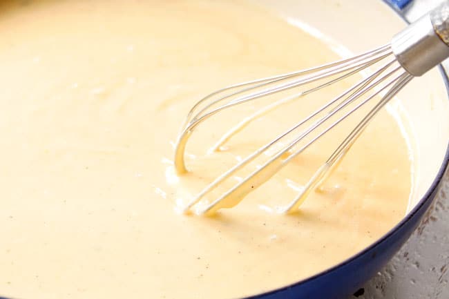 showing how to make hashbrown casserole without canned soup by making a roux and whisking in chicken broth and milk