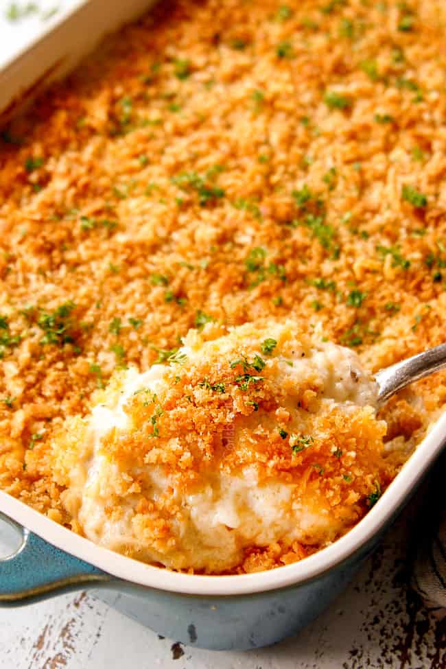 showing how to garnish easy
hashbrown casserole by topping with parsley