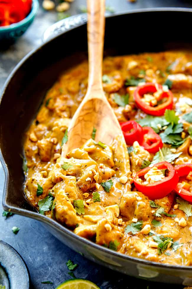 up close of a spoonful peanut sauce chicken showing how creamy it is