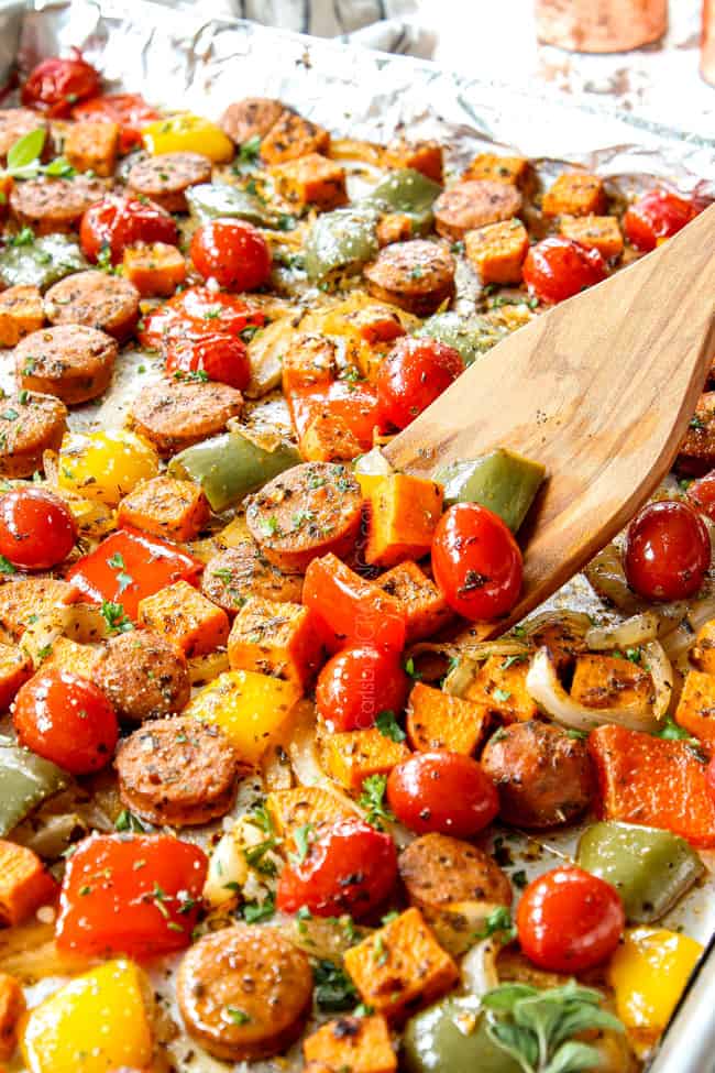 showing how to serve baked Sausage and Peppers by garnishing with fresh parsley