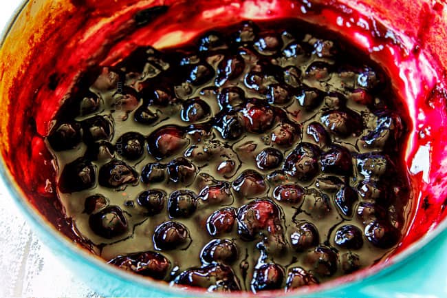 showing how to make lemon ricotta pancakes by simmering blueberries in a saucepan
