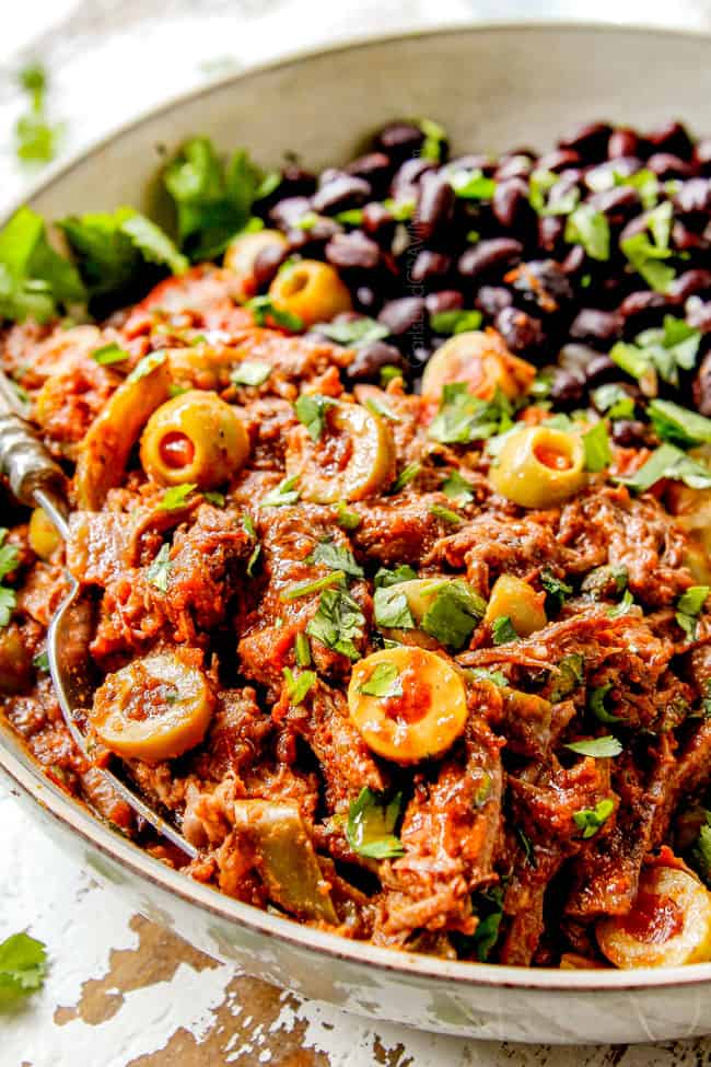 up close of Cuban Ropa Vieja in a bowl showing how juicy the beef is
