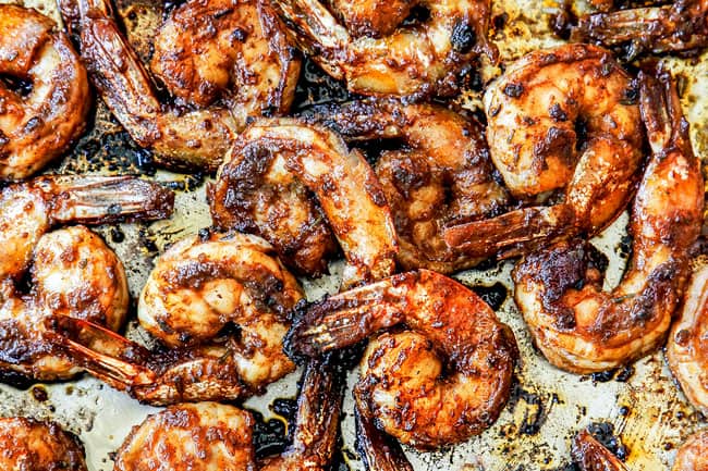 showing how to make jerk shrimp cooking in a skillet